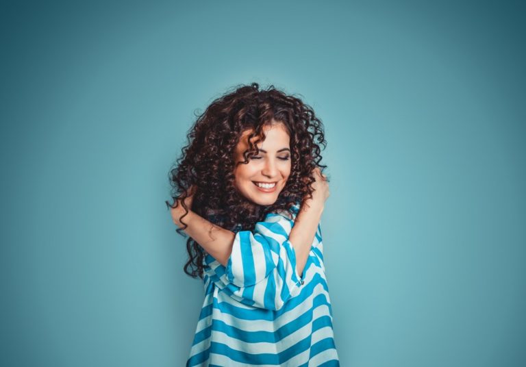 Girl hugging herself