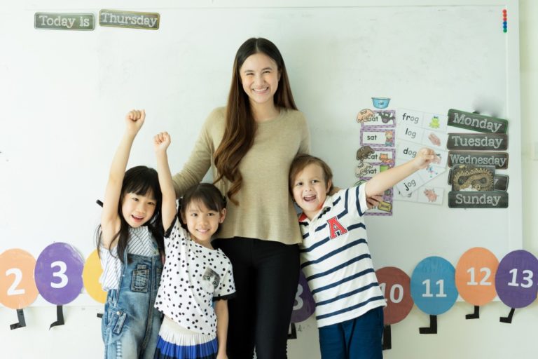 teacher with young students